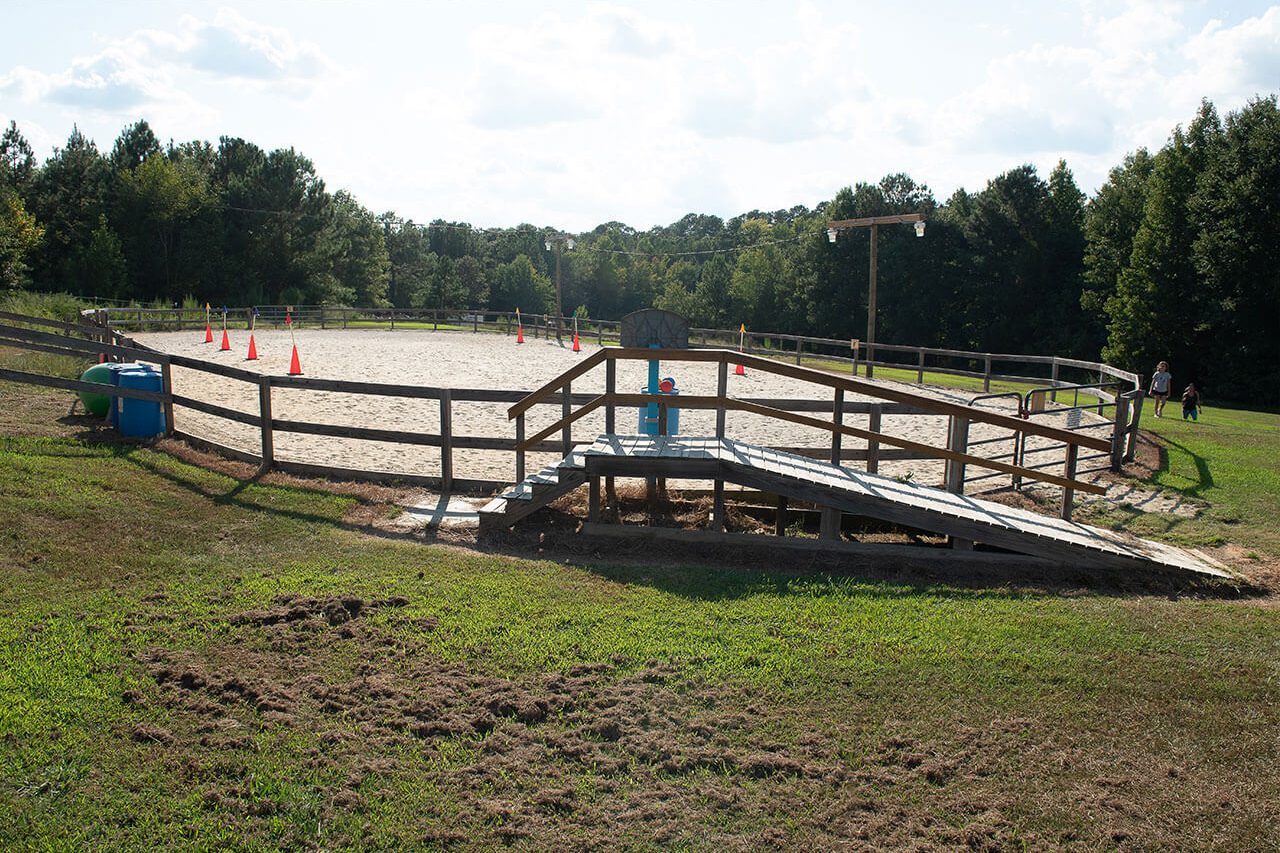 Outside view of the sand arena used for hippotherapy sessions at Carolina Therapeutic Ranch in Rock Hill, SC